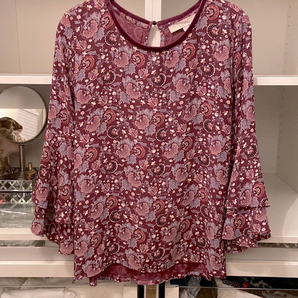 Floral pull over blouse with many shades of purple